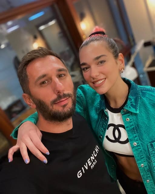 Dua Lipa with a Groomsmith barber in the shop